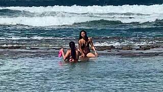 two pretty brunettes flaunt big asses on public beach
