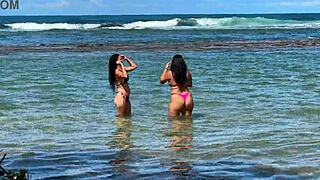 two pretty brunettes flaunt big asses on public beach