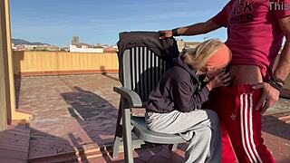 blonde wife deepthroats neighbor cock swallows cum closeup on balcony terrace