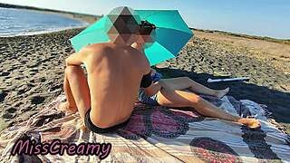 french teacher kneels for student's huge cock deepthroat on crowded nudist beach, risking public exposure