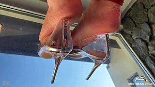 bare feet tease in see-through heels dangling closeup