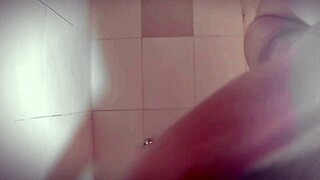 I'm stroking my huge cock in the shower till I explode sexy style
