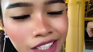 skinny tattooed asian beauty chats while wielding huge dildo