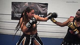 Fiesty feminista battles male in mixed boxing sparring ring.