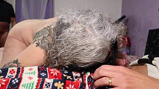 tattooed granny's pussy stretched by two throbbing cocks