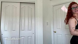 Sexy redhead with tattoos tries on new shirts in bra and panties