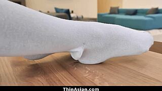 slim asian woman builds tension during deep intense session