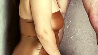 I'm slipping into shiny nylons, eagerly sucking this thick leather lollipop deep