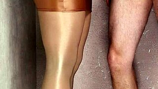 I'm slipping into shiny nylons, eagerly sucking this thick leather lollipop deep