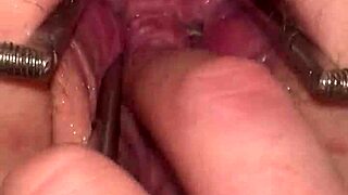 fist queen's pussy stretched wide by metal ring extreme