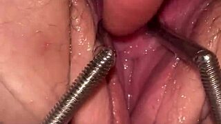 fist queen's pussy stretched wide by metal ring extreme