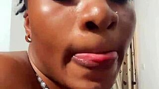 Naija babe Candy slurps massive black cock hungrily