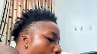 Naija babe Candy slurps massive black cock hungrily