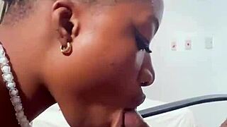 Naija babe Candy slurps massive black cock hungrily