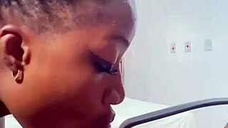 Naija babe Candy slurps massive black cock hungrily