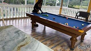 Sayafit and Anissa Miller playfully tease with pool balls and cue near their curves by the pool