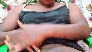 Watch this black crossdresser stroke oiled monster cock to cum