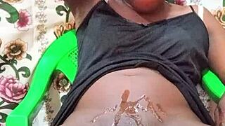 Watch this black crossdresser stroke oiled monster cock to cum
