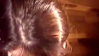 A milf kneels as monster cock unloads cumshot across her face