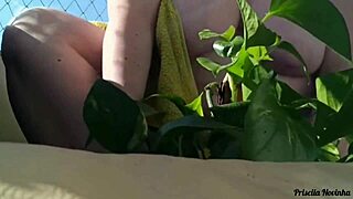 naked outdoor flashing big tits and miniskirt on balcony watering plants