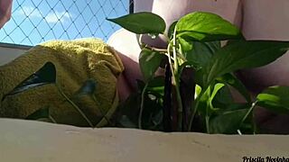 naked outdoor flashing big tits and miniskirt on balcony watering plants