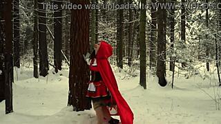 red hood tempts deep in snowy forest on christmas adventure