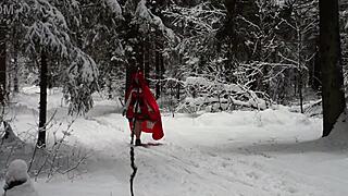 red hood tempts deep in snowy forest on christmas adventure