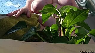 naked outdoor flashing big tits and miniskirt on balcony watering plants