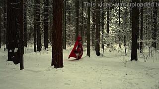 red hood tempts deep in snowy forest on christmas adventure