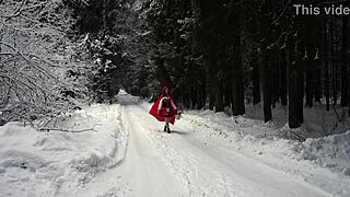 red hood tempts deep in snowy forest on christmas adventure