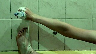 beautiful cute girl assol bathes in soapy foam on body
