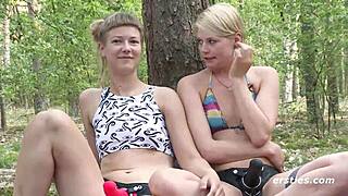 Pierced German lesbian blondes lick shaved pussies before outdoor strapon pounding