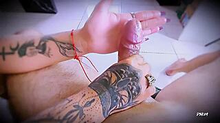 Tattooed hands stroke close up