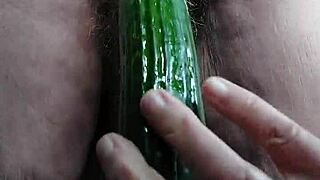 old horny slut fucks pussy with cucumber