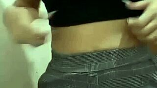 Sexy woman changing clothes while recording