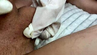 Amateur jerks cock in gloves