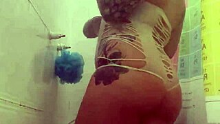 Alina enjoys a full time shower with tattoos
