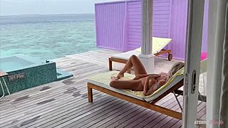 Naked blonde masturbates and gets fucked the room service waiter poolside