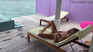 Naked blonde masturbates and gets fucked the room service waiter poolside