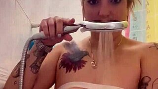 Alina enjoys a full time shower with tattoos