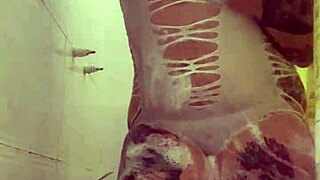 Alina enjoys a full time shower with tattoos
