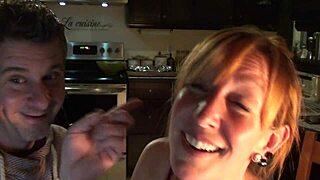 Cute Canadian redhead couple cooks in the kitchen