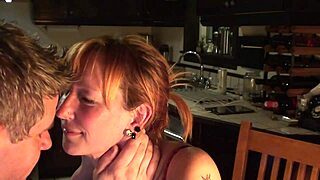Cute Canadian redhead couple cooks in the kitchen